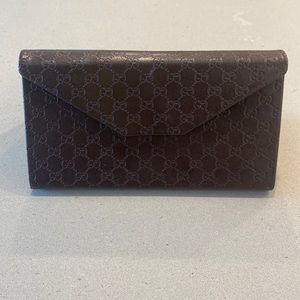 Gucci brown leather sunglasses case.